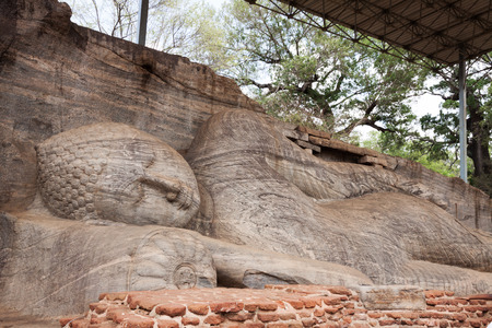 Statue of lying Buddha at  Gal Vihara in Polonnaruwa or Pulattipura ancient city,  Kingdom of Polonnaruwa in Sri Lankaの写真素材