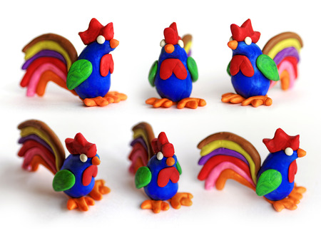 Set of plasticine cocks in different views. Modeling clay roosters isolated on white background. Chinese symbol of New Year 2017.の写真素材