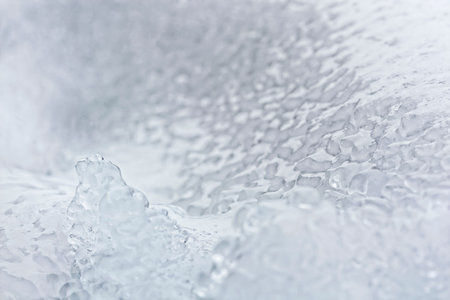 Icy crust on the snow. Close up background.