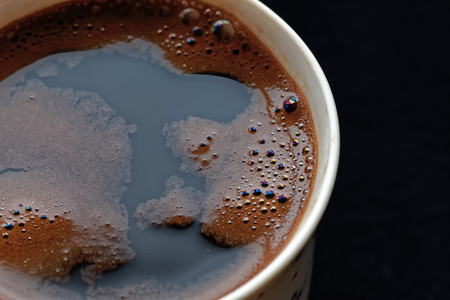 Close up of fresh coffee with foam.の写真素材