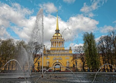Admiralty building in the center of St. Petersburg, Russia. Fountain in front of the tower in sunny day. Tinted photoの写真素材