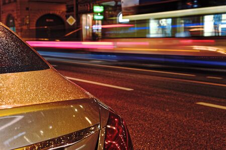 Blurred night traffic. Light trails on the road at night on Bolshoy Prospekt Petrograd Side in Saint-Petersburg, Russiaの写真素材