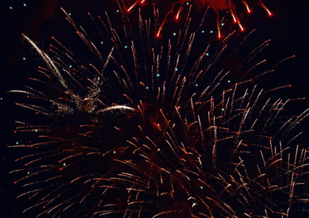 Colorful fireworks on dark night sky background. Holiday light