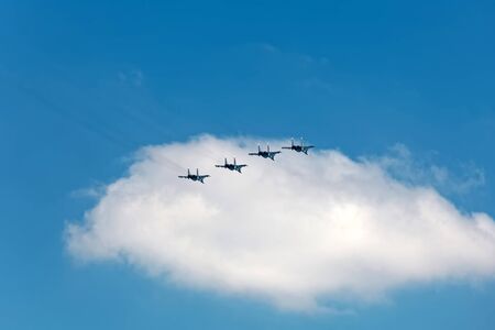 SAINT-PETERSBURG, RUSSIA - JULY 29, 2018: Warships parade on the Neva river. Day of the Russian Navy. Combat aircraft in skyのeditorial素材