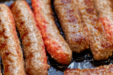 Close up grilled homemade meat sausages. Shallow depth a fieldの写真素材