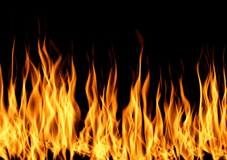 Blazing flame of burning fire over black background