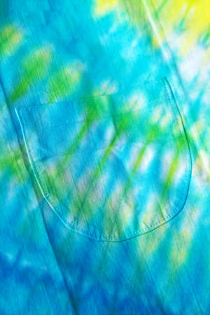Close up of a colorful tie dye abstract background. Hand dyed on cotton fabric texture backdrop.の写真素材