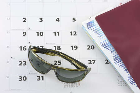 Sunglasses and tickets on the calendarの写真素材