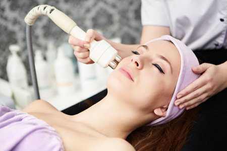 woman face treatment in medical spa centerの写真素材