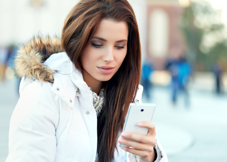 beautiful young woman writing a messageの写真素材