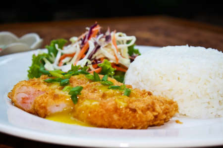 Shrimp cakes with curry powder sauce.の写真素材