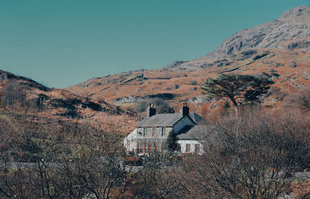 A view of a house in the middle of the Scottish Highlands.の写真素材
