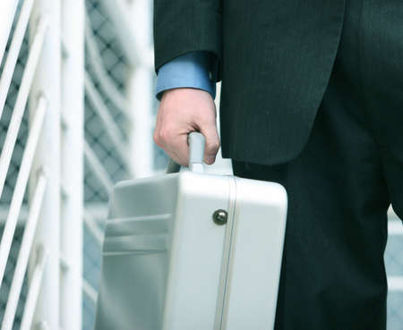 business man holding his briefcaseの写真素材