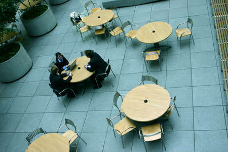 business people sitting and discussing at a tableの写真素材