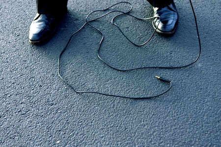 Business man lets loose his wires の写真素材