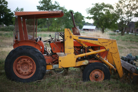 Profile view of older farm tractor