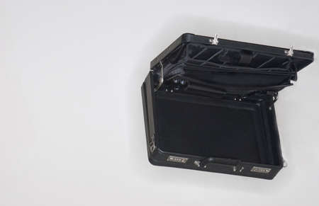 A black rectangular briefcase is open against a white backgroundの写真素材