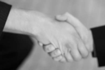 close up of handshake between two businessmenの写真素材