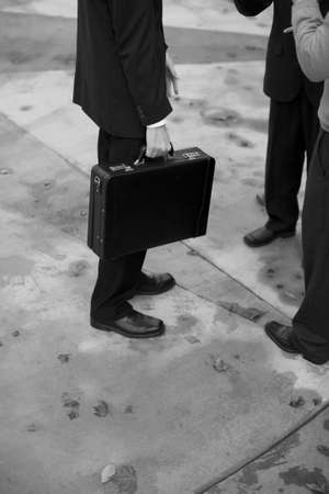 three-quarter shot of business people having a conversation outsideの写真素材