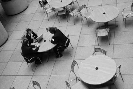 small group of business people conversing at tableの写真素材