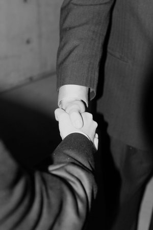 close up of handshake between two businessmen