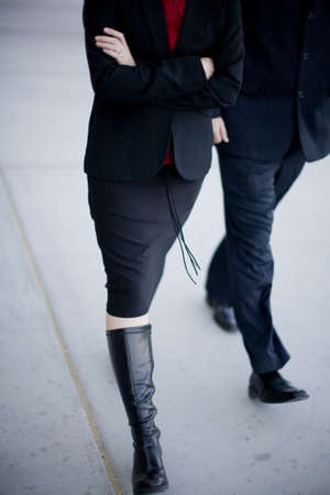 Two business people walking together fastの写真素材