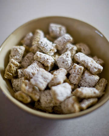 A bowl of cereal for breakfast with a bunch of grain in the cereal bowlの写真素材