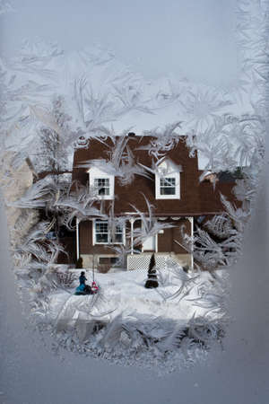 Winter street through the icy window...のeditorial素材