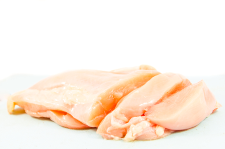 chicken breast on blue blockの写真素材