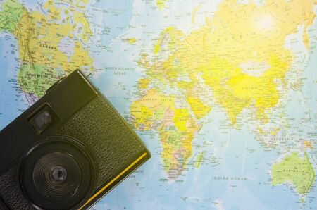 film camera lay on world mapの写真素材