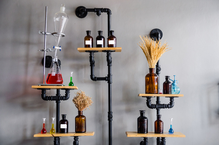 Beaker and pipe on wallの写真素材
