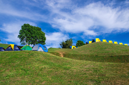 tent camping on green hillの写真素材