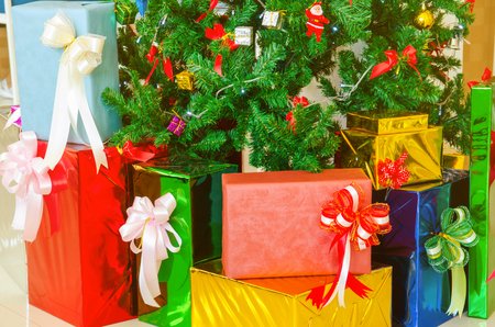 colorful gift under christmas treeの写真素材