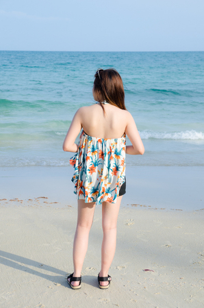 back asian women portrait on beachの写真素材