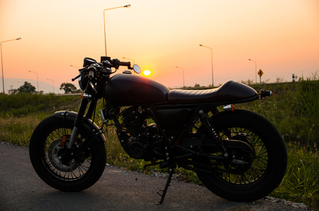 vintage motorcycle cafe racer style with sunset sceneの写真素材