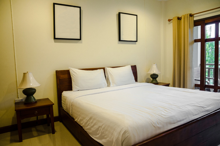 interior of bedroom with white bedの写真素材