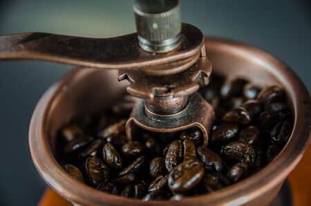 close up of coffee beans in coffee grinderの写真素材