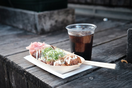 Eating takoyaki in Dotonbori, Osaka.の写真素材