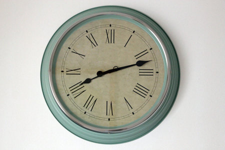 Old fashioned clock on a white background