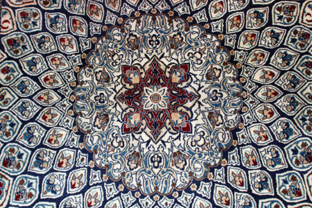 Close up of a Persian rug with abstract symmetrical designの写真素材