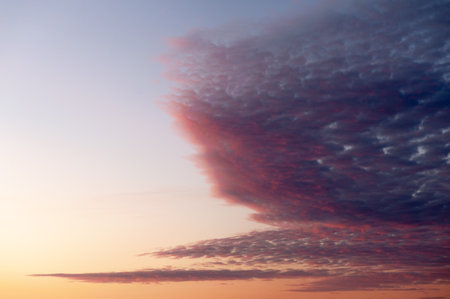 Sunset sky background with clouds. Beautiful sunset sky with clouds.の写真素材