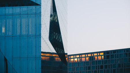 Modern office building skyscrapers in business district at sunset time.の写真素材