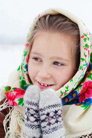 Winter Holidays - Happy winter Vacation at the Countryside. Happy Beautiful Girl in Headscarf. Christmasの写真素材