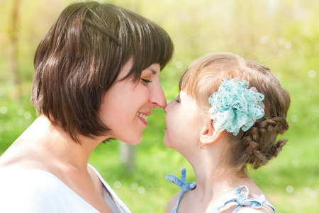 Happy Family at Summer. Love and Kisses. Mother and Daughter.の写真素材