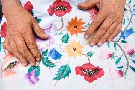Closeup of an Old Womans Hands - Senior Woman Hands with Handworkの写真素材