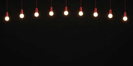 Glowing light bulbs on dark concrete background. 3D renderingの写真素材