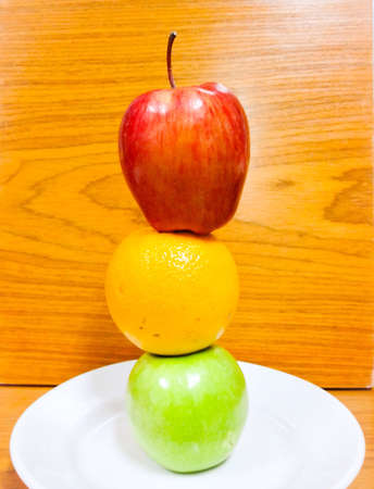 fresh fruit are red apple and green apple and orangeの素材
