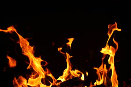 Blurred background. Fire flames pattern on black.の写真素材