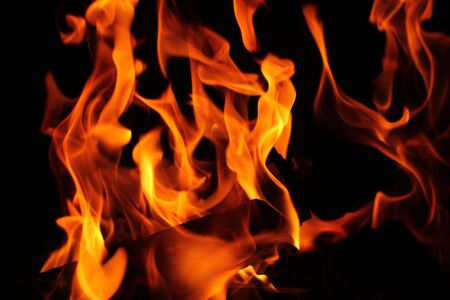 Blurred background. Fire flames pattern on black.の写真素材