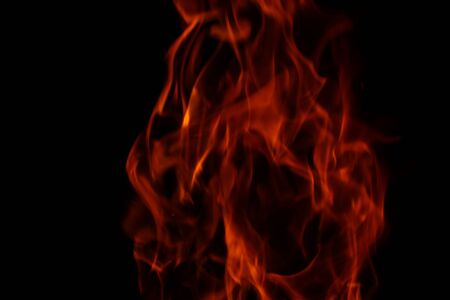 Blurred background. Fire flames pattern on black.の写真素材